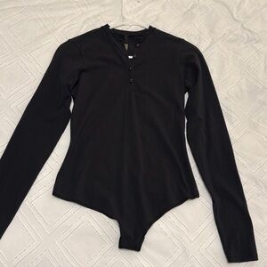 SKIMS COTTON JERSEY LONG SLEEVE HENLEY BODYSUIT Black